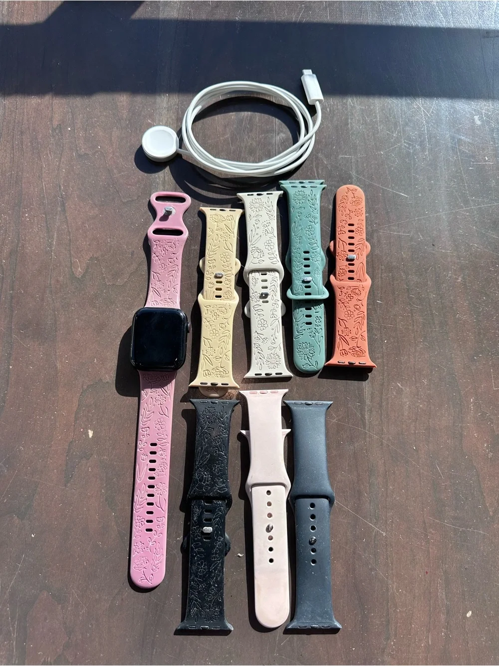 Apple Smartwatch with Black Case and Light Pink Sport Band